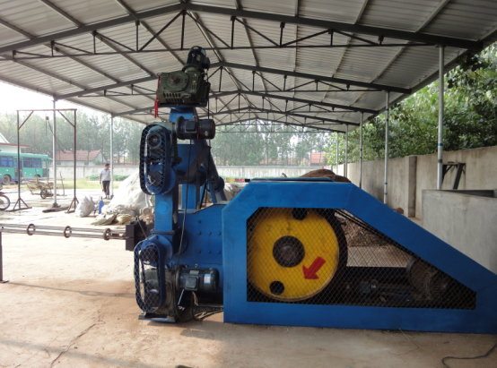 Side view of briquette machine